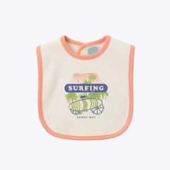 Surfing Samui Bay Baby Bib - Ivory with Coral Trimming